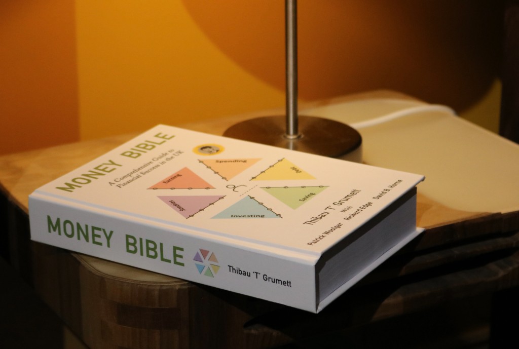 Money Bible hardcover on a side table